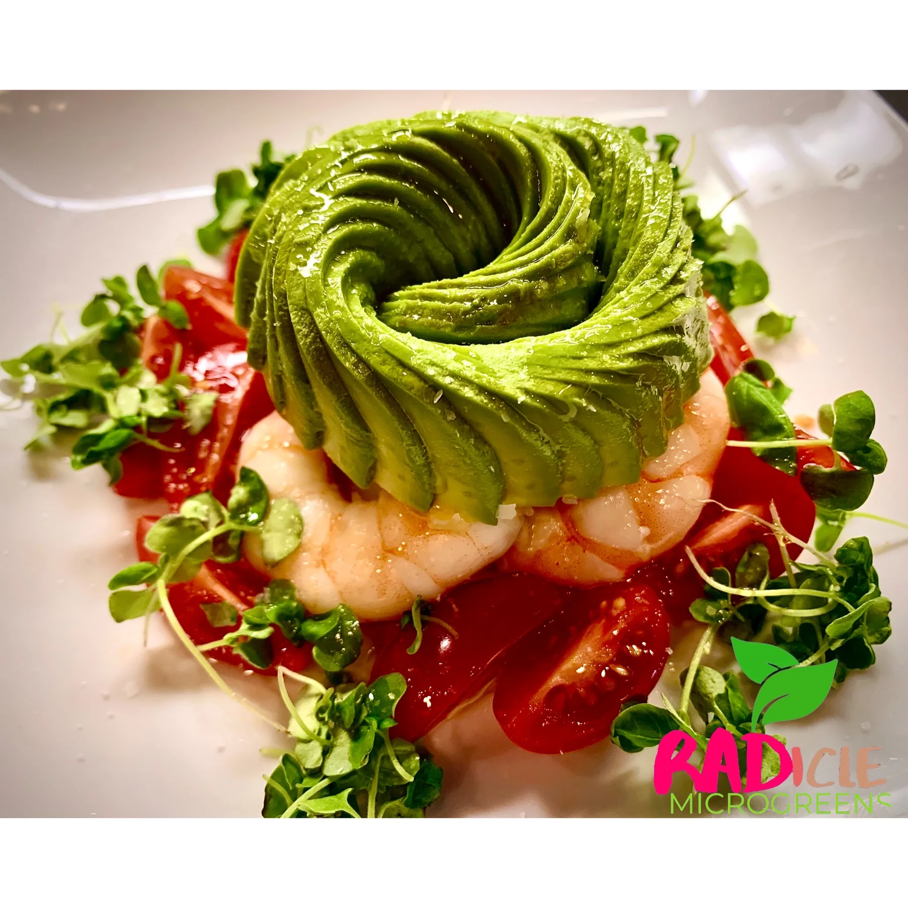 Shrimp and avocado plate with broccoli microgreens