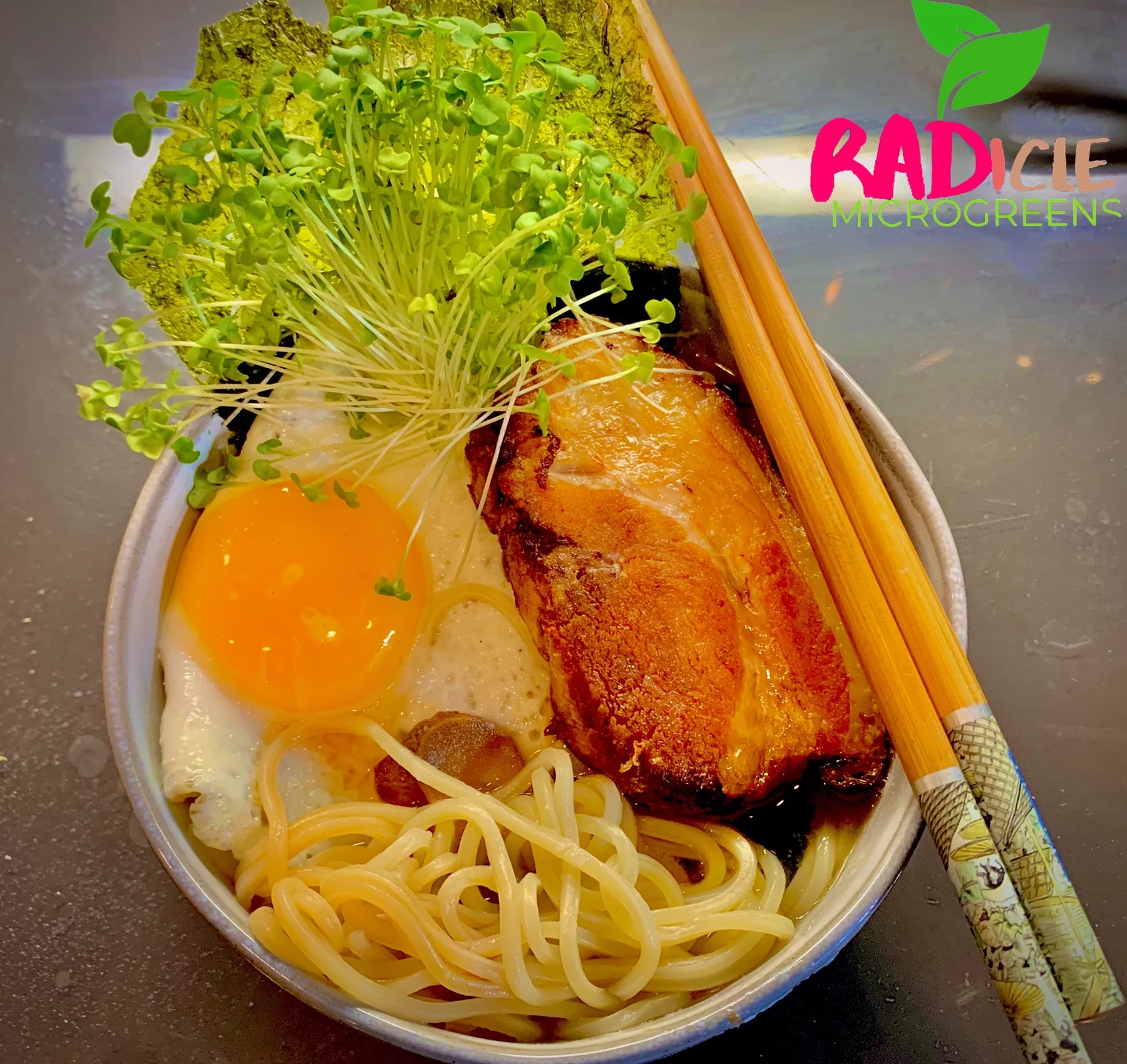 Ramen bowl with egg and broccoli microgreens